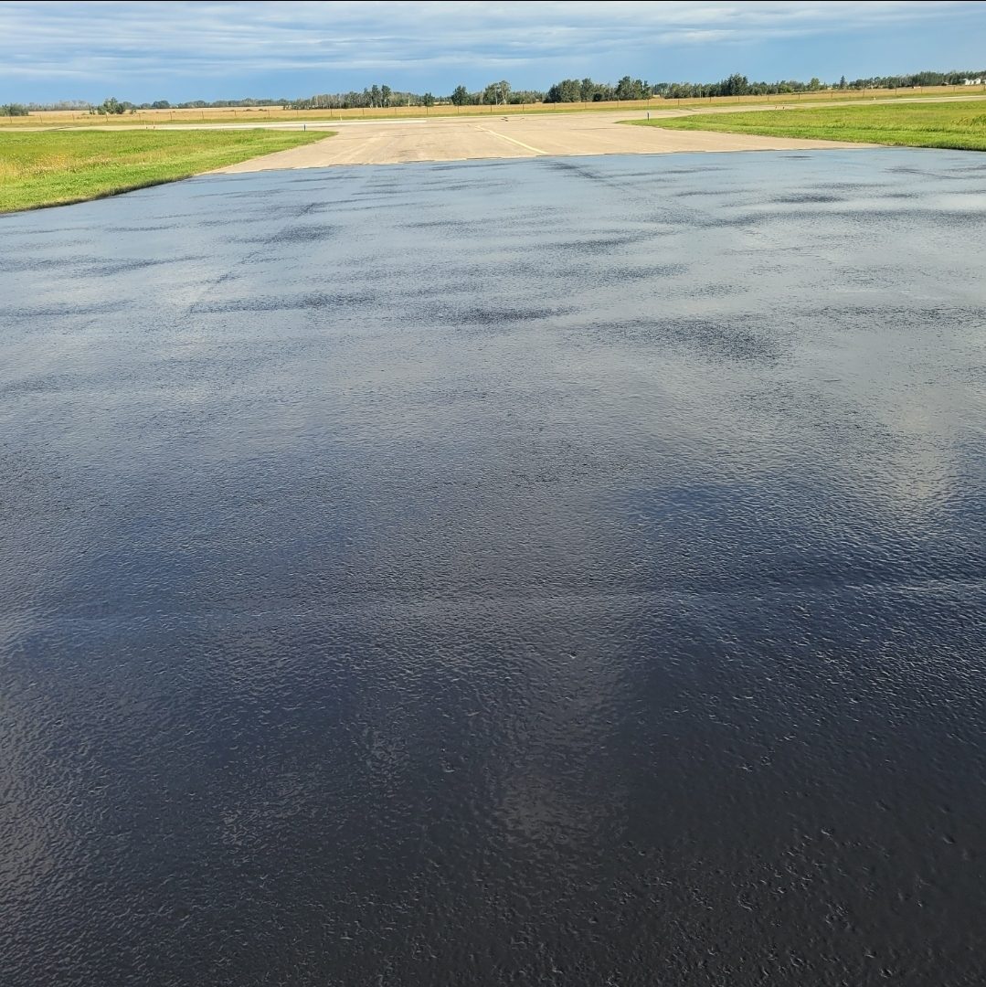 Freshly sealed airport runway